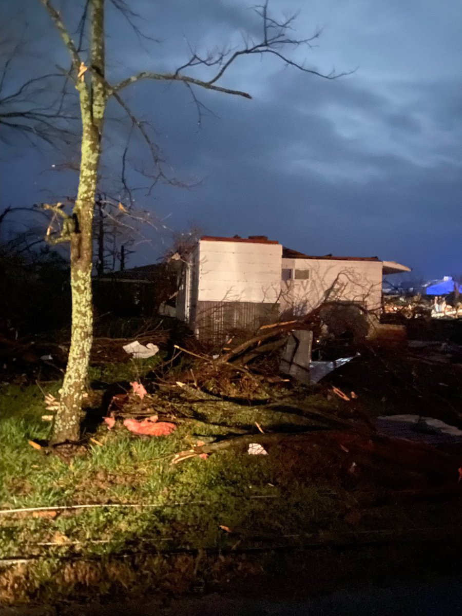 Buildings destroyed in Cave City, Arkansas, after a tornado-warned storm; emergency crews are responding