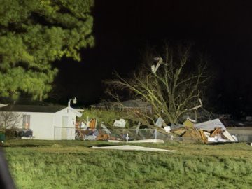 Buildings destroyed in Cave City, Arkansas, after a tornado-warned storm; emergency crews are responding